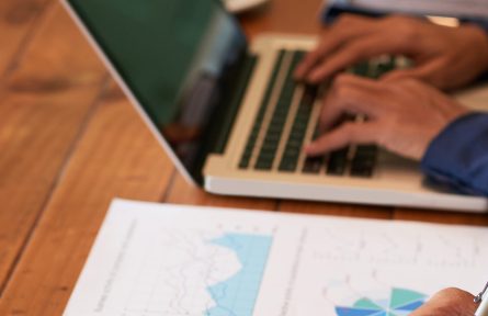 Close-up image of entrepreneur checking document before signing